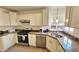 Efficient kitchen featuring stainless steel appliances, granite countertops, and ample cabinet space at 1520 W Encanto Blvd, Phoenix, AZ 85007