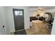 Inviting living room view with a stylish front door, neutral paint, and seamless transition to living spaces at 1520 W Encanto Blvd, Phoenix, AZ 85007
