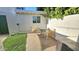 Cozy outdoor patio space with seating and greenery creating a relaxing backyard atmosphere at 1520 W Encanto Blvd, Phoenix, AZ 85007