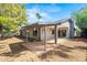 Exterior view of a covered patio in a well-maintained backyard provides outdoor living at 16412 N 33Rd Ave, Phoenix, AZ 85053