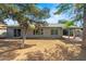 Backyard with large windows, a covered patio, and low maintenance landscaping at 16412 N 33Rd Ave, Phoenix, AZ 85053