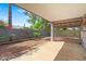 Covered patio and well-maintained yard provides a relaxing outdoor living space at 16412 N 33Rd Ave, Phoenix, AZ 85053