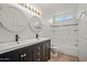 Stylish bathroom boasts a double sink vanity, modern fixtures, and a clean, well-lit atmosphere at 16412 N 33Rd Ave, Phoenix, AZ 85053