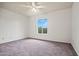Spacious bedroom with natural light and plush carpeting, providing a comfortable retreat at 16412 N 33Rd Ave, Phoenix, AZ 85053