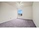 This bedroom features a ceiling fan and a window providing plenty of natural light at 16412 N 33Rd Ave, Phoenix, AZ 85053