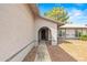 Inviting front door with decorative glass, an arched entryway, desert landscaping, and a well-maintained home exterior at 16412 N 33Rd Ave, Phoenix, AZ 85053