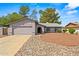 Well-kept house with two car garage, desert landscaping, and a cozy, inviting front entrance in a quiet neighborhood at 16412 N 33Rd Ave, Phoenix, AZ 85053
