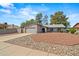 Single-Gathering home featuring desert landscaping, an attached two-car garage, and well-maintained exterior in a Gathering neighborhood at 16412 N 33Rd Ave, Phoenix, AZ 85053