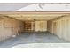 Spacious two-car garage with brick walls, shelving, and ample storage space at 16412 N 33Rd Ave, Phoenix, AZ 85053