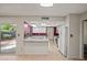 Well-lit kitchen featuring white cabinetry, modern appliances, and an inviting breakfast bar area at 16412 N 33Rd Ave, Phoenix, AZ 85053