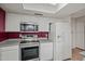 Updated kitchen features stainless steel appliances, including microwave and electric range at 16412 N 33Rd Ave, Phoenix, AZ 85053