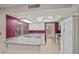 Bright kitchen with white cabinets, modern appliances, and a stylish accent wall, perfect for cooking at 16412 N 33Rd Ave, Phoenix, AZ 85053