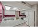 Bright kitchen featuring white cabinetry, modern appliances, and a functional layout with eat-in bar at 16412 N 33Rd Ave, Phoenix, AZ 85053