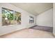 Bright living room boasting large windows offering serene outdoor views and an abundance of natural light at 16412 N 33Rd Ave, Phoenix, AZ 85053