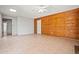 Bright living room with a mix of wood paneling and neutral walls, offering a versatile living space at 16412 N 33Rd Ave, Phoenix, AZ 85053
