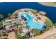 Aerial view of a community pool, palm trees, and recreational area at 16781 S 181St Ln, Goodyear, AZ 85338