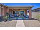 Inviting back patio with comfortable seating, ambient lighting, and well-maintained landscaping at 16781 S 181St Ln, Goodyear, AZ 85338