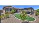 Expansive backyard featuring desert landscaping, an artificial turf area, and a covered patio at 16781 S 181St Ln, Goodyear, AZ 85338