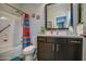 Bathroom boasts modern vanity and well-lit shower-tub combination with colorful curtain at 16781 S 181St Ln, Goodyear, AZ 85338