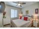 Cozy bedroom featuring a ceiling fan, neutral walls, and a comfortable bed with stylish decor at 16781 S 181St Ln, Goodyear, AZ 85338