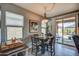 Cozy dining area with access to outdoor patio featuring stylish decor and natural light at 16781 S 181St Ln, Goodyear, AZ 85338