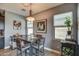 Cozy dining area featuring stylish decor and natural light from two windows at 16781 S 181St Ln, Goodyear, AZ 85338