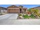 Charming single-Gathering home with a two-car garage, desert landscaping, and gated courtyard at 16781 S 181St Ln, Goodyear, AZ 85338