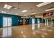 Spacious fitness studio with mirrors, wall art, and hardwood flooring at 16781 S 181St Ln, Goodyear, AZ 85338