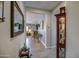 Inviting hallway with wood-look tile flooring, neutral paint, and decorative accents at 16781 S 181St Ln, Goodyear, AZ 85338