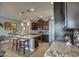 Spacious kitchen with granite countertops, dark cabinets and a stainless steel gas range at 16781 S 181St Ln, Goodyear, AZ 85338