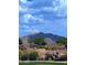 Expansive mountain view with artful landscaping, rock features, and manicured grounds at 16781 S 181St Ln, Goodyear, AZ 85338
