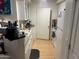Compact kitchen with laminate floor, standard appliances, and ample countertop space at 1701 E Colter St # 264, Phoenix, AZ 85016