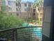 Overlooking a community pool surrounded by lush greenery, creating a serene and inviting retreat at 1701 E Colter St # 264, Phoenix, AZ 85016