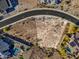 Desert land available to build a home in a luxury community; the lot is surrounded by upscale homes and desert landscaping at 17837 W Estes Way, Goodyear, AZ 85338