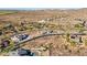Expansive aerial view showcases desert homes, mountains, and landscape in a high end Arizona neighborhood at 17837 W Estes Way, Goodyear, AZ 85338