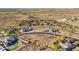 Expansive desert landscape featuring luxury homes, meticulously planned roads, and beautiful flowering trees in a desert setting at 17837 W Estes Way, Goodyear, AZ 85338