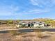Beautiful single-story home with desert landscaping and mountain views, showcasing its charming facade and curb appeal at 17837 W Estes Way, Goodyear, AZ 85338