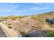 Scenic desert land, ready for a new home, with beautiful views and desert landscaping at 17837 W Estes Way, Goodyear, AZ 85338