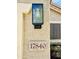 Close-up image of the house number and an exterior light fixture at 17840 N Smith Dr, Maricopa, AZ 85139