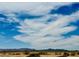Wide shot of distant mountains across a landscape, emphasizing the area's natural beauty and surroundings at 17840 N Smith Dr, Maricopa, AZ 85139