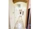 Hallway features tile flooring and framed art decorations on the wall at 17840 N Smith Dr, Maricopa, AZ 85139
