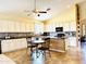 Bright kitchen offers an island with seating, a table, and plenty of storage at 17840 N Smith Dr, Maricopa, AZ 85139