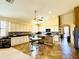 Spacious eat-in kitchen boasts an island with a breakfast bar and updated stainless appliances at 17840 N Smith Dr, Maricopa, AZ 85139