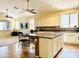 Spacious kitchen features an island, a dining table, and ample cabinet space at 17840 N Smith Dr, Maricopa, AZ 85139