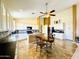 Open kitchen featuring an island with breakfast bar, sleek countertops, and modern appliances at 17840 N Smith Dr, Maricopa, AZ 85139