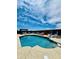 Enjoy this backyard pool with lounge chairs and a covered patio at 17840 N Smith Dr, Maricopa, AZ 85139