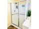 Glass enclosed shower with a built in seat and grab bars at 17840 N Smith Dr, Maricopa, AZ 85139