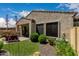 Inviting backyard featuring an outdoor kitchen, patio seating, and lush green lawn at 1813 N Trowbridge --, Mesa, AZ 85207