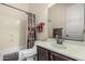 Cozy bathroom featuring a shower-tub combo and dark wood vanity at 1813 N Trowbridge --, Mesa, AZ 85207