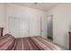 Bedroom features a queen bed, large closet, and neutral color palette at 1813 N Trowbridge --, Mesa, AZ 85207